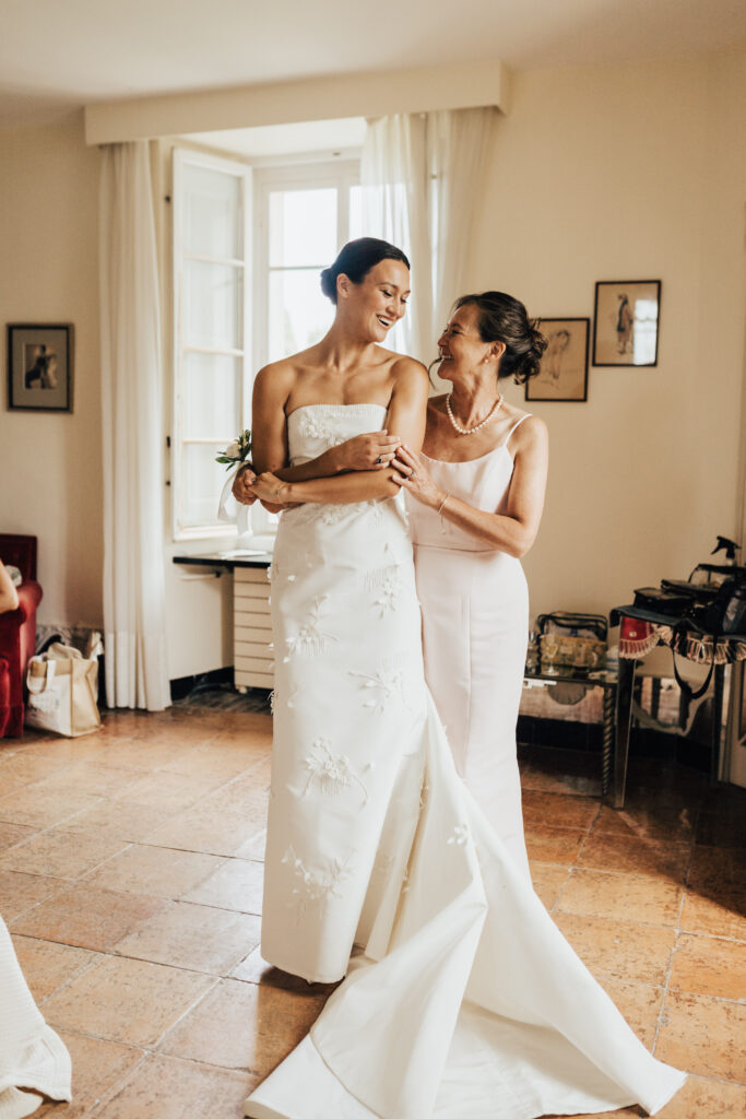 Bride getting ready on her wedding day with her mother