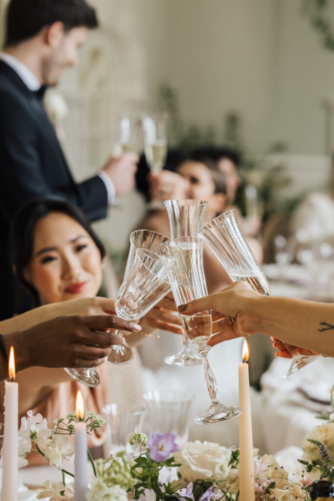 photo of champagne glasses toasting