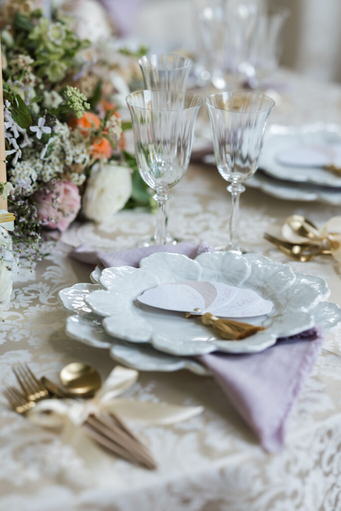 pastel floral arrangement with candles on round tables