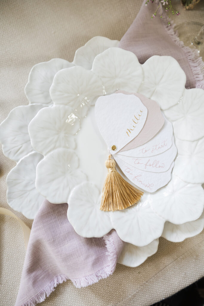 close up plate with place card setting with fan style menu