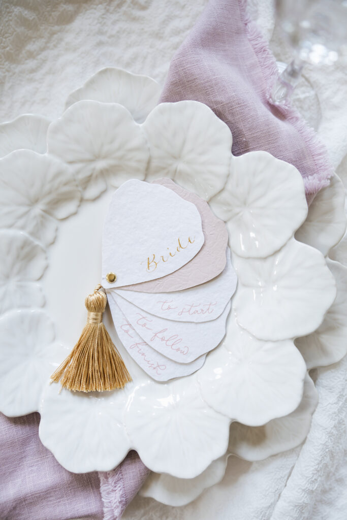 close up plate with place card setting with fan style menu