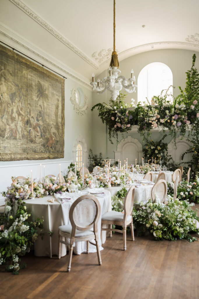 pastel floral arrangement with candles on round tables