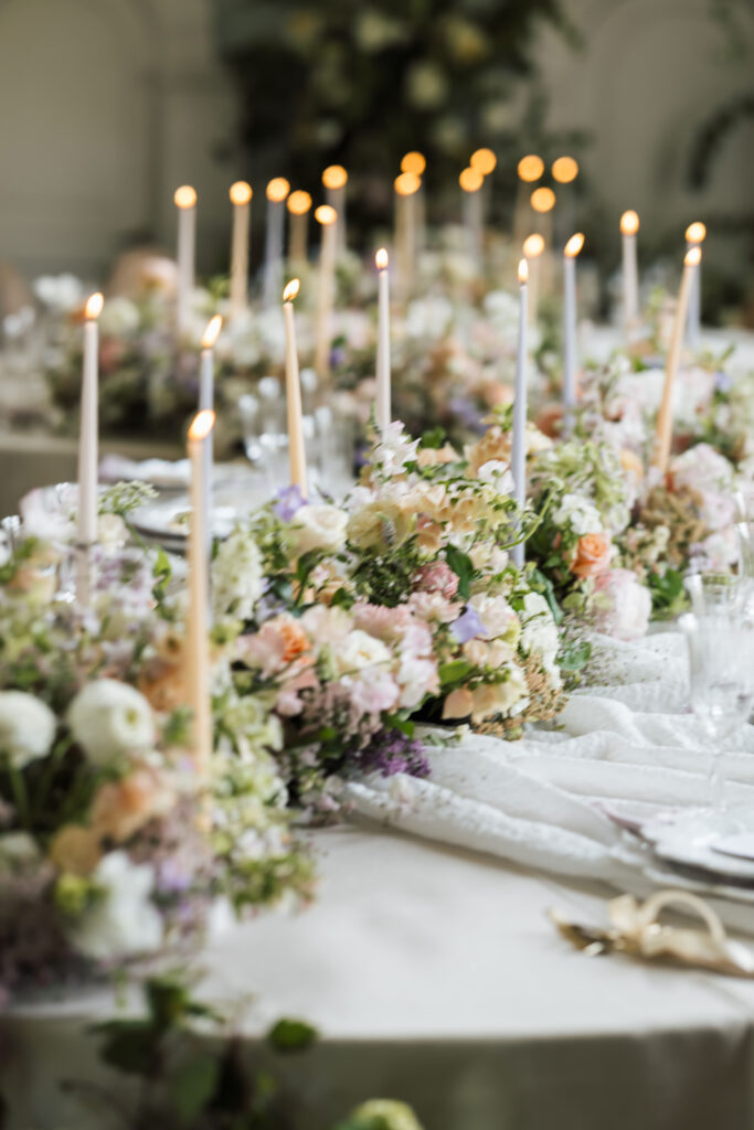 pastel floral arrangement with candles