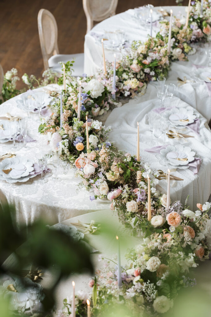 pastel floral arrangement with candles