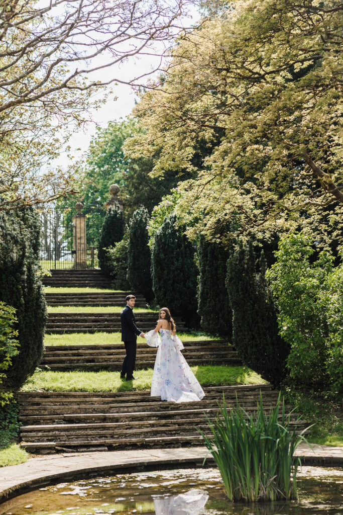 bride and groom on steps at Cornwell Manor