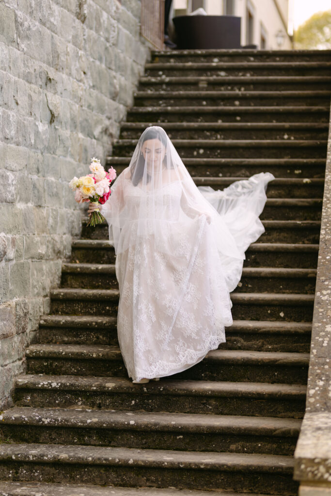 bride walking down steps during wedding ceremony