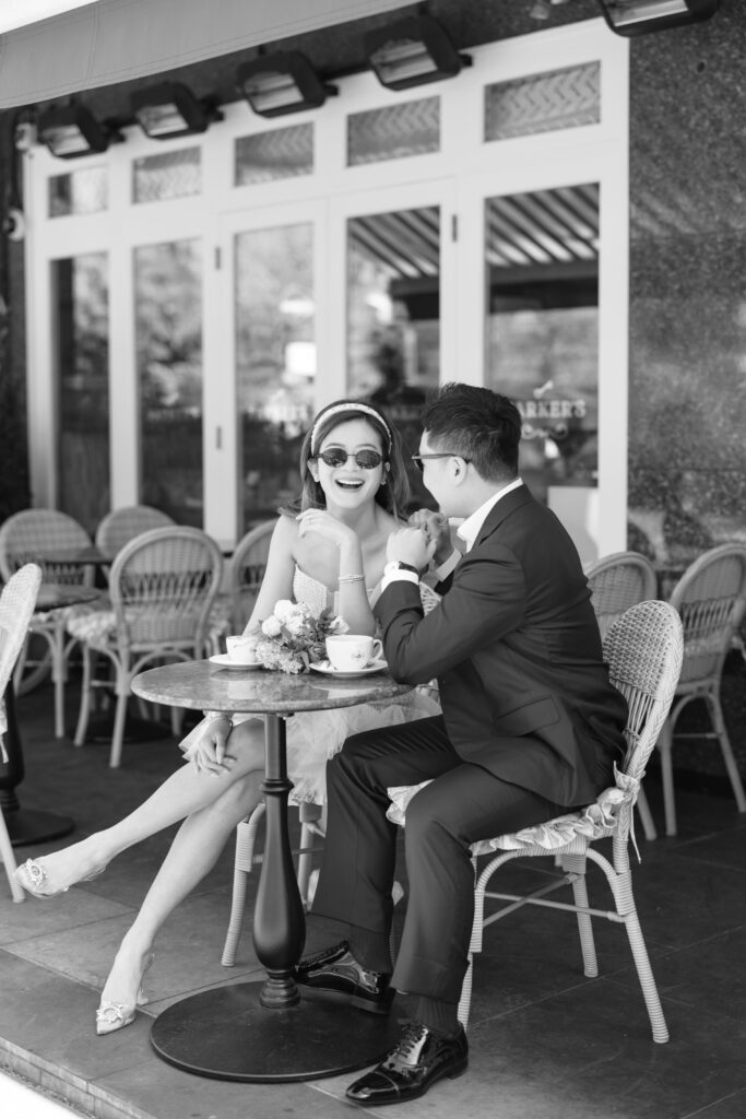 photo of girl resting on table wearing liz Martinez bridal mini dress