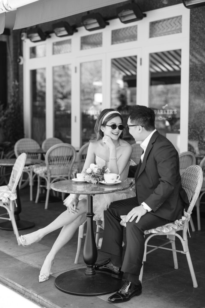 photo of girl resting on table wearing liz Martinez bridal mini dress