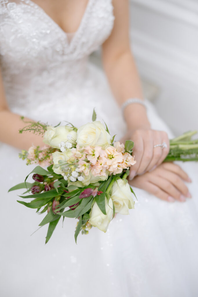 bouquet of flowers on brides lap