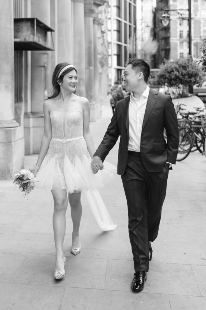 bride and groom holding hands