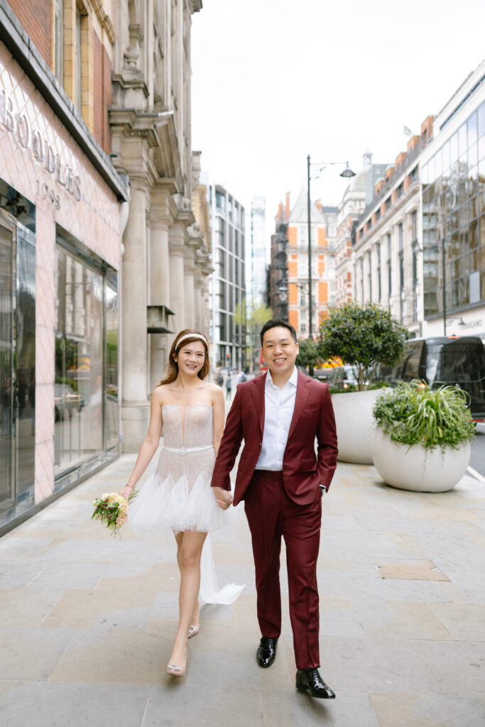 bride and groom holding hands