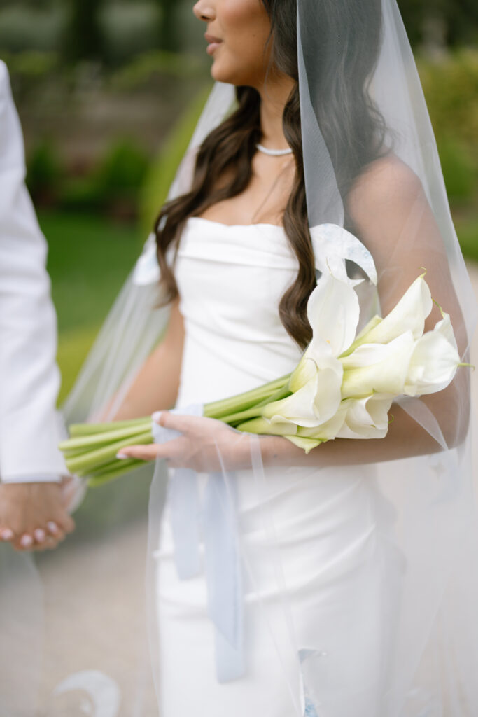 bride and groom walking holding hands