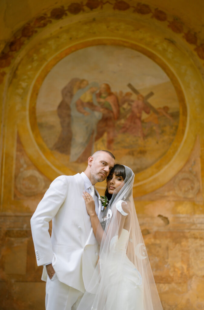 bride and groom infront of votive chapel at Villa Cetinale