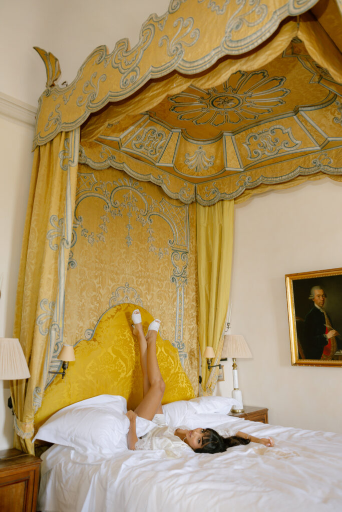 Bride wearing white shoes legs up in air
