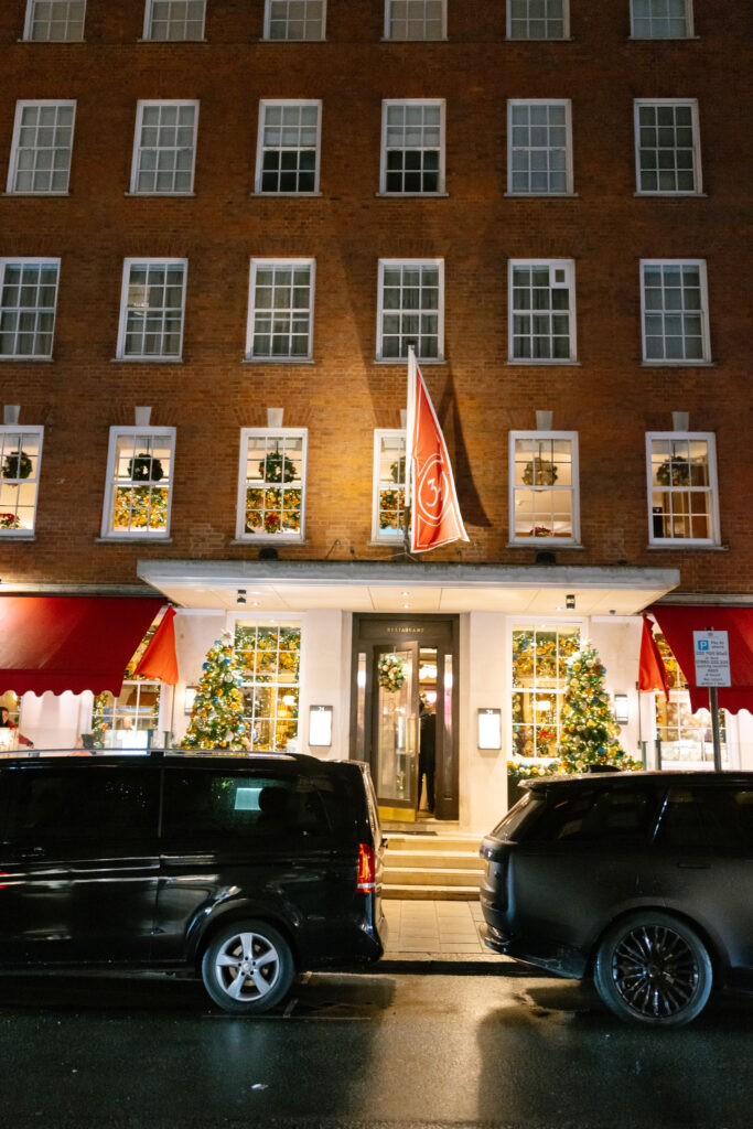 Cars parked cars outside of a building.