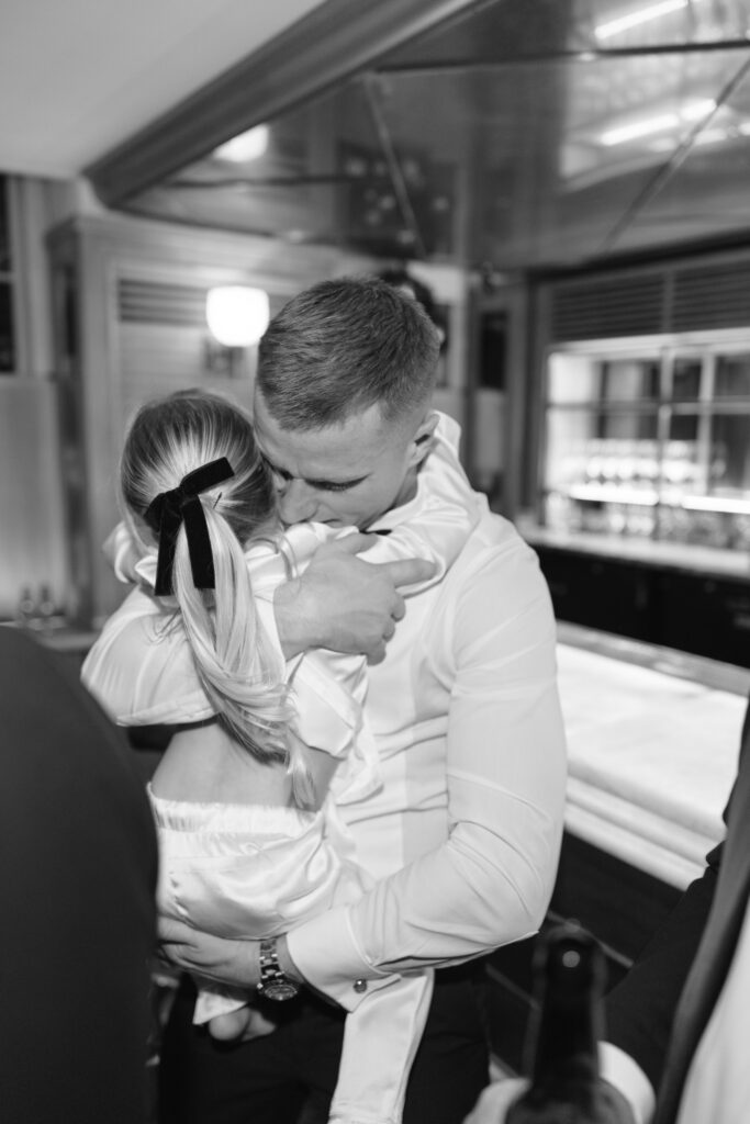 A man and woman hugging.