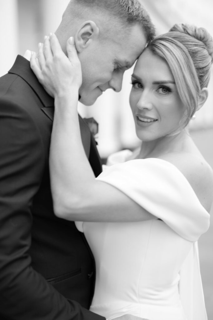 A man and woman hugging.